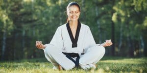Martial Arts Lessons for Adults in _Citrus Heights_ _CA_ - Happy Woman Meditated Sitting Background